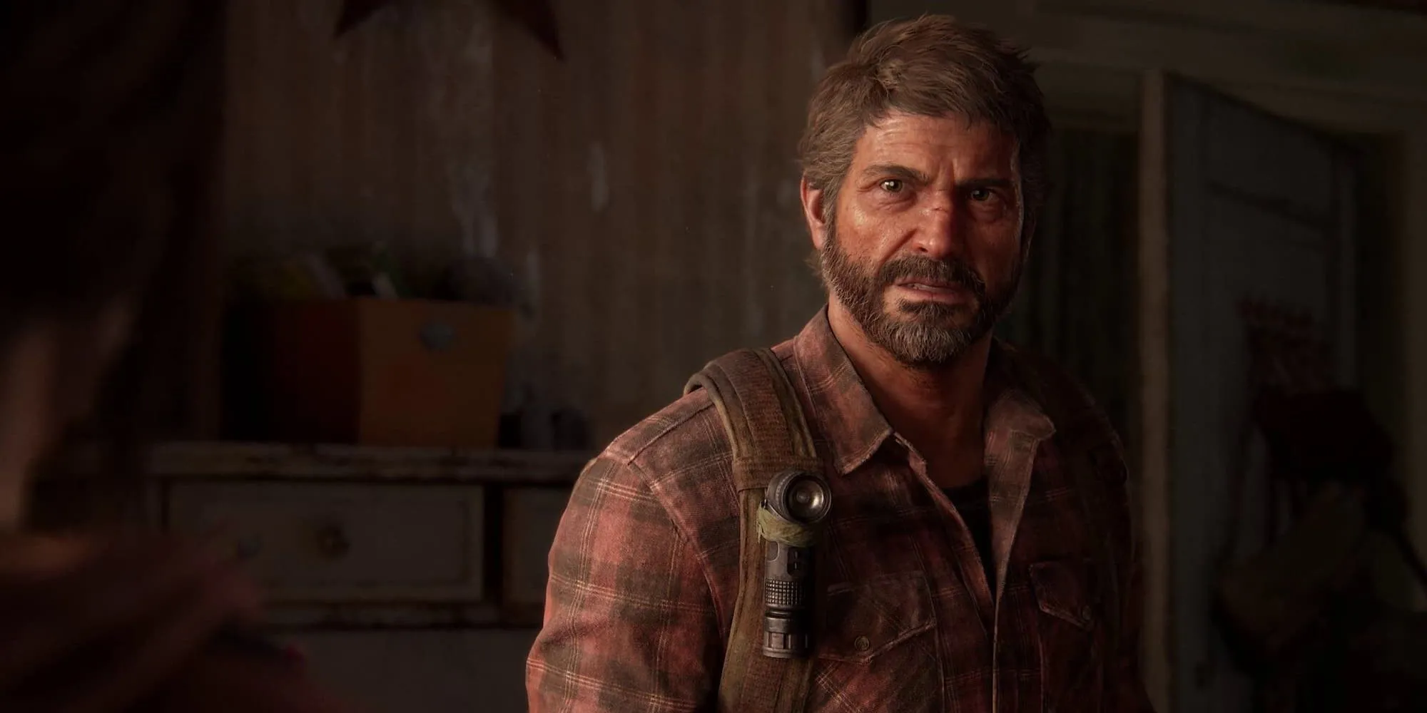 Ảnh chụp màn hình The Last of Us Part 1 cho thấy Joel và Ellie