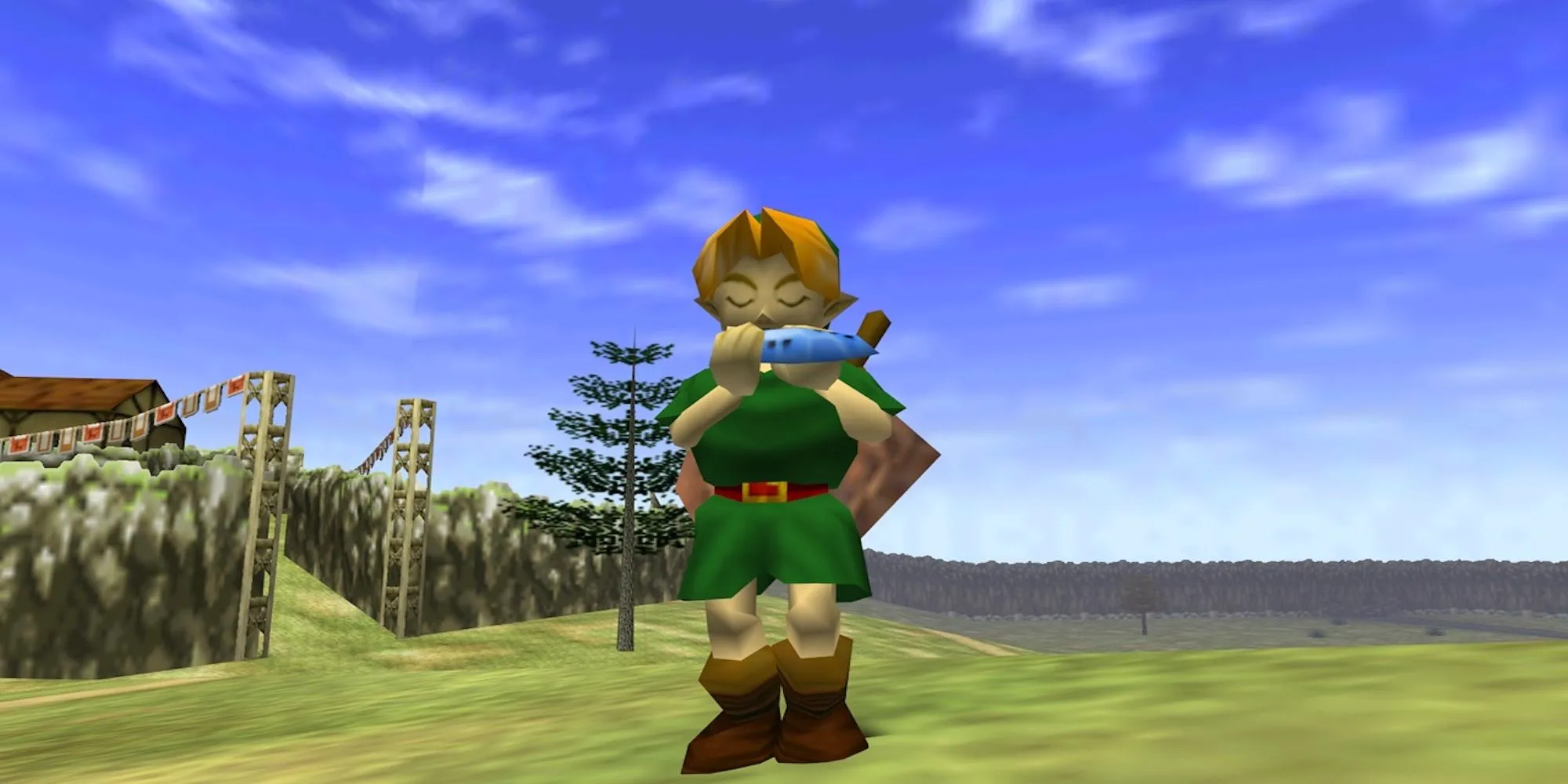 Link thời trẻ trong The Legend of Zelda Ocarina of Time đứng trước Lâu đài Hyrule.
