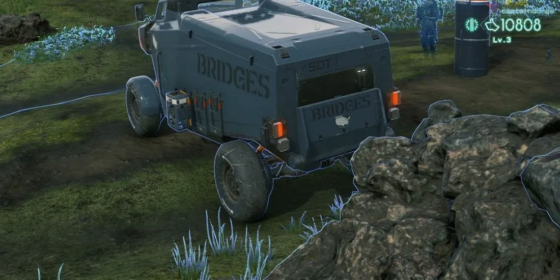 Chiếc xe tải địa hình (truck) trong Death Stranding đứng cạnh một tảng đá, thể hiện khả năng vượt địa hình bằng phương tiện